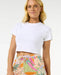 Rip Curl Cala Vadella shorts with tropical print, drawstring waist, worn with white crop top