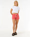 Rip Curl women's hibiscus red surf shorts with drawstring, model standing