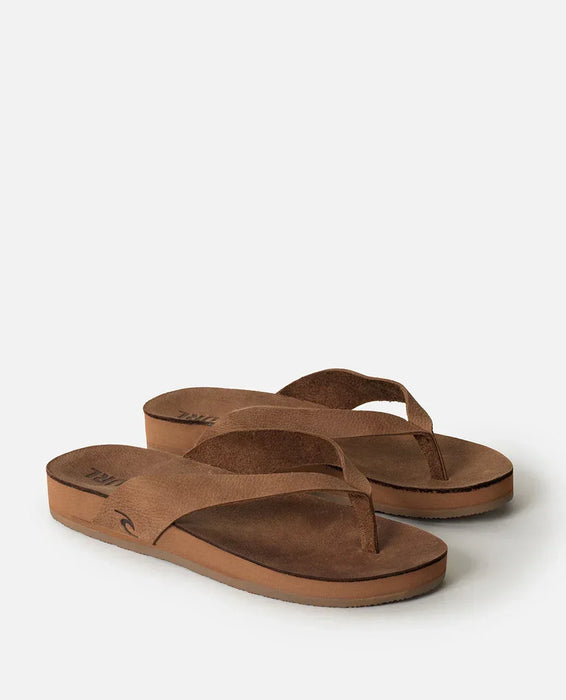 Rip Curl tan leather open toe sandals with logo and flat sole, ideal for beachwear