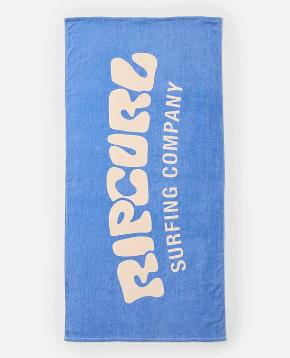 Rip Curl blue graphic surf towel with large white logo and 'Surfing Company' text