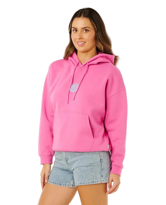 Rip Curl pink surf hoodie with front logo, worn by woman in denim shorts