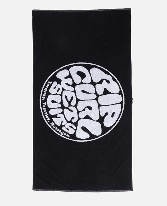 Rip Curl black surf towel with bold white logo, ideal for watersports and beach use