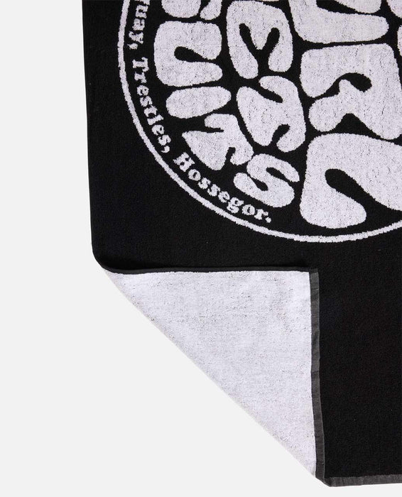 Rip Curl black and white surf towel with bold logo, ideal for watersports and beach use