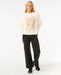 Woman wearing Rip Curl Luna relaxed crew sweatshirt in bone with graphic front, surf clothing