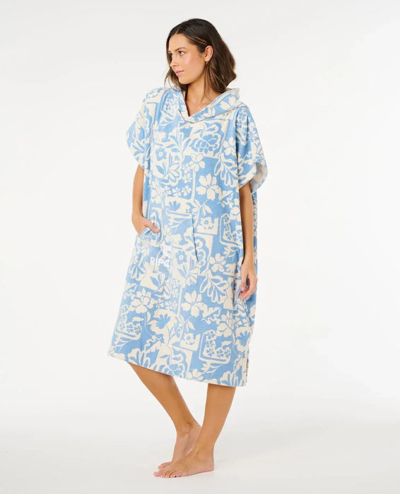 Rip Curl hooded towel poncho in blue and cream floral pattern, ideal for watersports