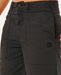 Rip Curl Premium Surf black walkshorts with logo patch, close-up on front pockets