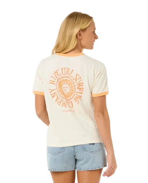 Woman wearing Rip Curl ringer tee in bone with orange trim and sun logo, surf clothing