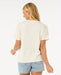 Rip Curl Sun and Sea relaxed bone tee on woman, paired with light denim shorts, back view