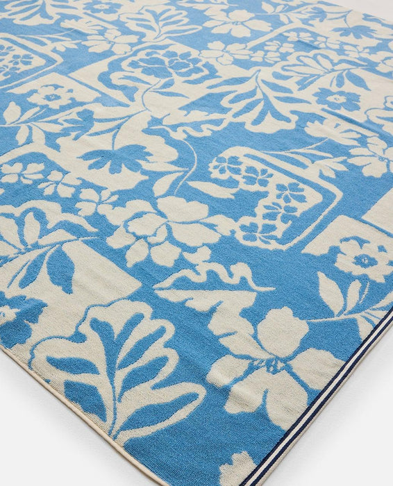 Rip Curl blue and white surf towel with floral pattern, cotton beach accessory