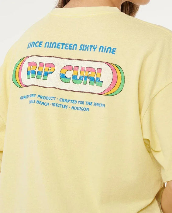Rip Curl pastel yellow surf t-shirt with retro logo and colourful text on the back
