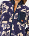 Rip Curl navy polar fleece jacket with cream floral print and zip pocket, surf clothing