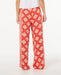 Rip Curl women's red wide leg pants with white floral print, back view