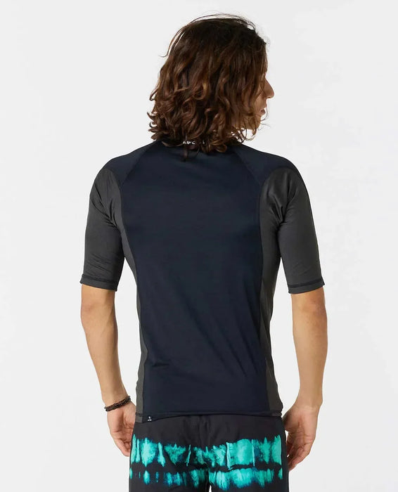 Rip Curl black short sleeve rash vest for watersports, back view, worn by male model