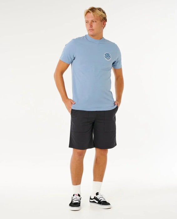 Rip Curl blue faded denim tee with logo, surf clothing for men, model wearing black shorts