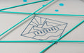 Sandbanks inflatable paddleboard deck with blue bungee cords and logo close-up