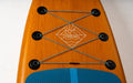 Sandbanks inflatable paddleboard with wood-look finish, blue deck pad and bungee storage cords