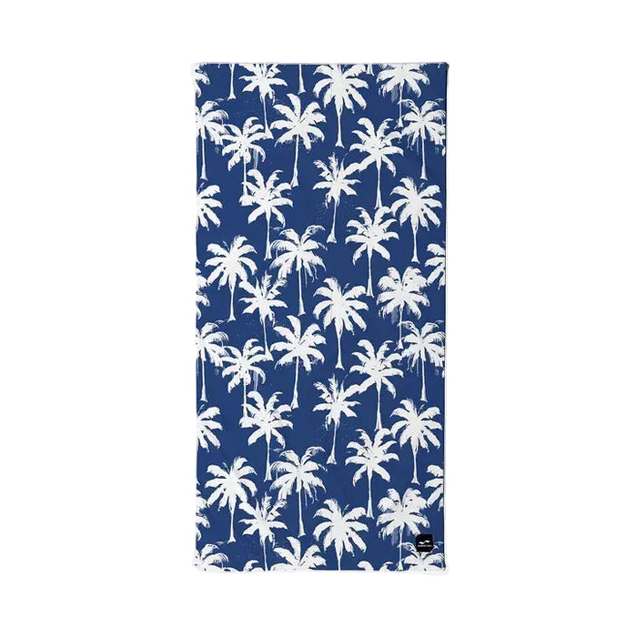 Slowtide Luca beach towel with white palm tree print on navy blue background