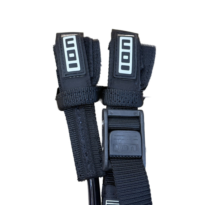 Close-up of ION Vario Race 2.0 harness line hook-and-loop end tabs with ION logo, all black