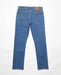Volcom Solver jeans in bold blue denim, rear view with two back pockets and leather patch