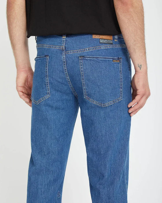 Volcom Solver jeans in bold blue, straight fit surf clothing with branded rear patch