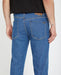 Volcom Solver jeans in bold blue, straight fit surf clothing with branded rear patch