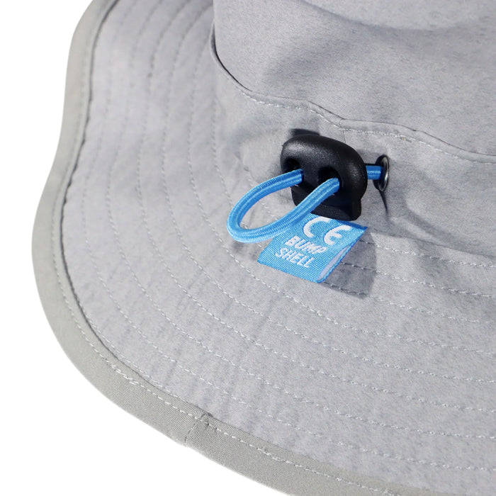 Grey Bump Shell surf hat with blue adjustable cord and safety certification tag
