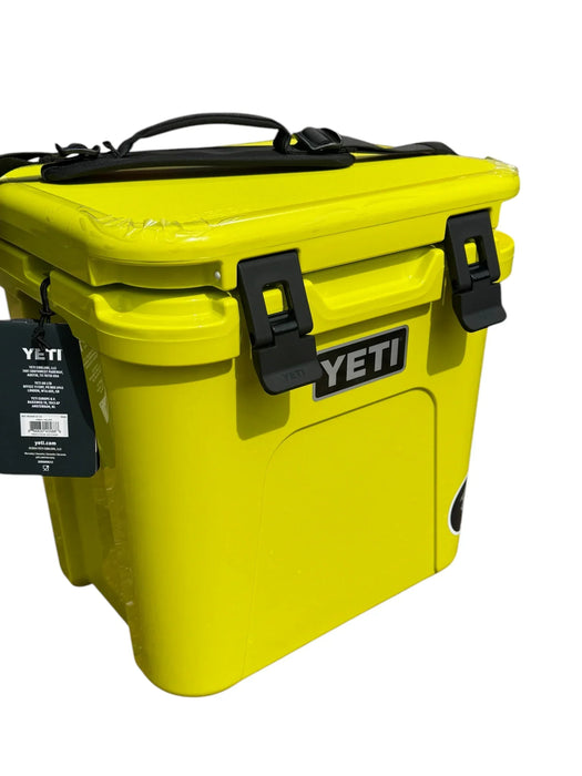 YETI Roadie 24 yellow cooler with black handle and latches, outdoor equipment